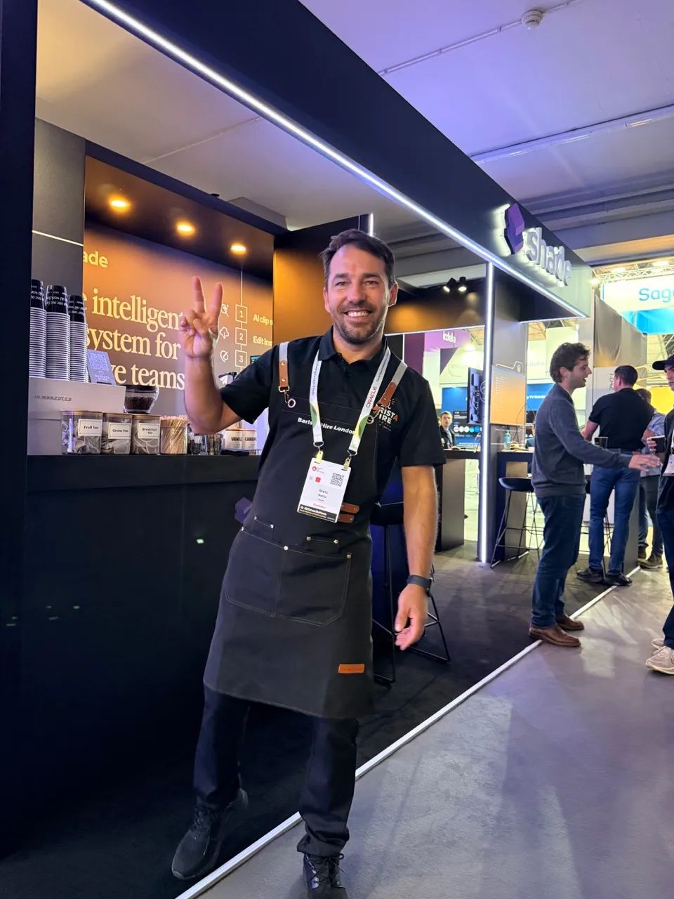 Professional barista making branded cans for event